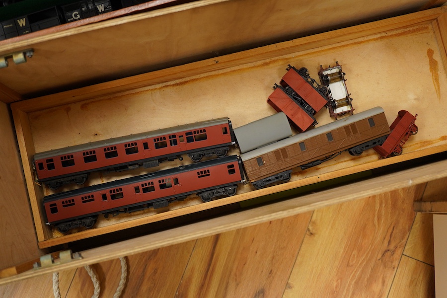 130 items of EM gauge model railway rolling stock contained within three handmade fitted wooden cases, two with removable trays, comprising three locomotives; an SR class 700 0-6-0 tender locomotive, 693, an SR 0-4-0T, 7
